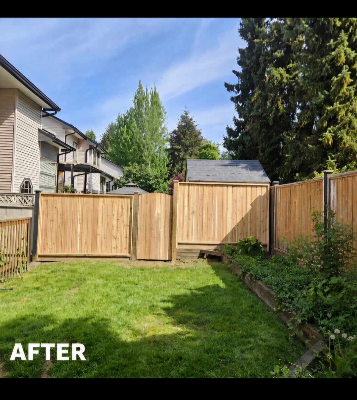 A cedar privacy fence with a retaining base solving a grade change along a property line